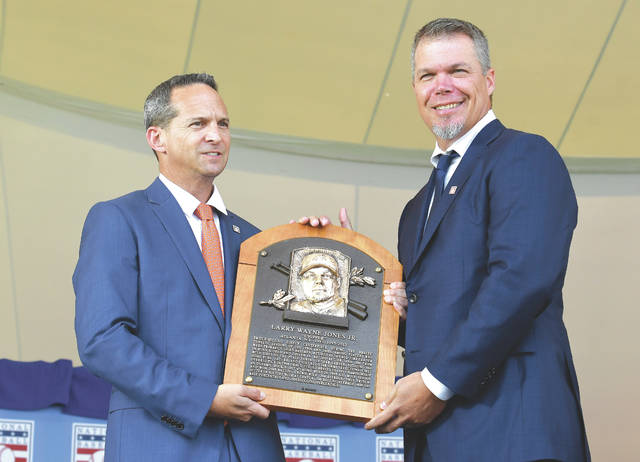 Trevor Hoffman and President of the Baseball Hall of Fame Jeff Idelson  holds his plaque before he delivers his Baseball Hall of Fame induction  speech at the Clark Sports Center in Cooperstown