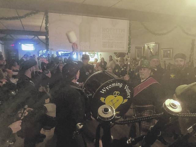 
			
				                                The Wyoming Valley Pipe and Drum Band serenades the crowd at Saturday evening’s Pre-Parade Pub Crawl at the Knights of Columbus in Pittston.
 
			
		