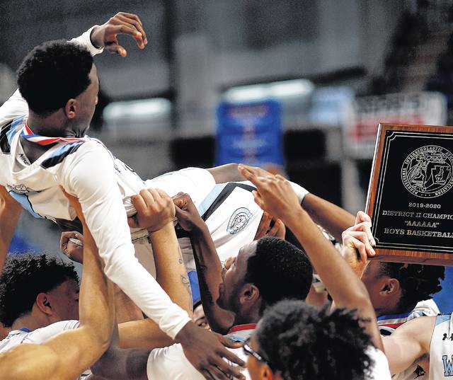 
			
				                                Wilkes-Barre Area point guard Saquan Portee is lifted over the heads of his teammates along with the District 2 championship plaque after the Wolfpack defeated Scranton for the Class 6A title on Saturday night at Mohegan Sun Arena.
                                 Fred Adams | For Times Leader

			
		