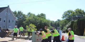 Wilkes-Barre firefighters pushed one of the floodgates on the Barney Street Bridge back into place Thursday and the roadway was later reopened to traffic. Jerry Lynott | Times Leader